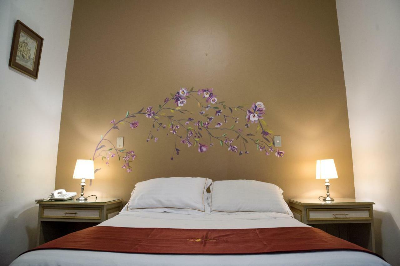 Hotel La Orquidea Cuenca Ruang foto
